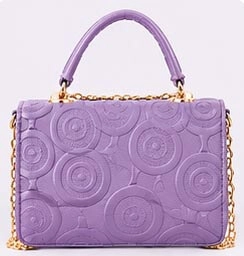 embossed purple ladies handbag front view
