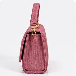 pink textured ladies handbag side profile pink textured ladies handbag side profile