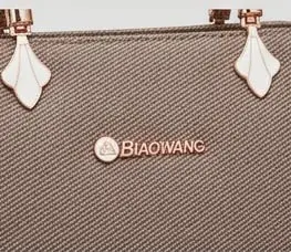 sabuj hub grey handbag logo closeup