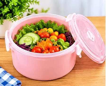 sabuj hub pink round lunch box filled with salad sabuj hub pink round lunch box filled with salad
