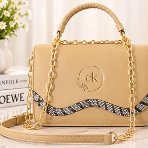 Stylish beige ladies handbag with gold chain