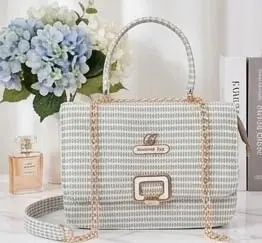 Stylish green and white textured ladies handbag with gold chain