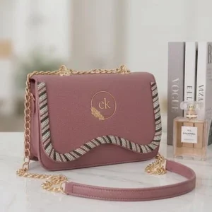 Stylish mauve pink ladies handbag with gold chain and crystals