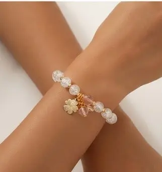 Cracked Glass Beaded Clover Charm Bracelet Crystal Cracked Glass Beaded Charm Bracelet with Gold Four-Leaf Clover Pendant on Wrist