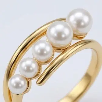 gold plated 5 pearl curved open bypass ring close up detail gold plated 5 pearl curved open bypass ring close up detail