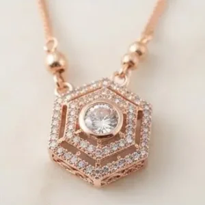 rose gold hexagon crystal pendant close up detail.