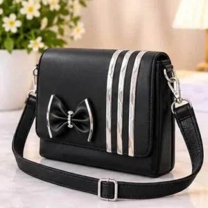 sabuj hub black bow and stripe crossbody bag angle view