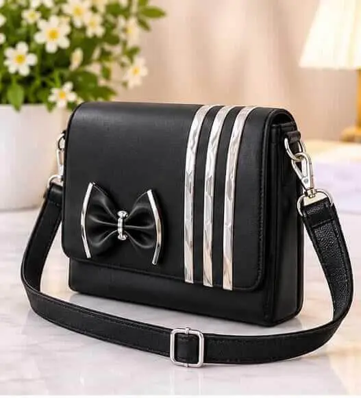 sabuj hub black bow and stripe crossbody bag angle view sabuj hub black bow and stripe crossbody bag angle view
