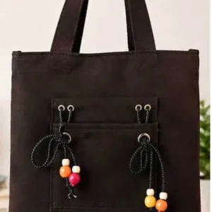 Sabuj Hub stylish black canvas tote bag featuring front pocket and colorful wooden beads decoration