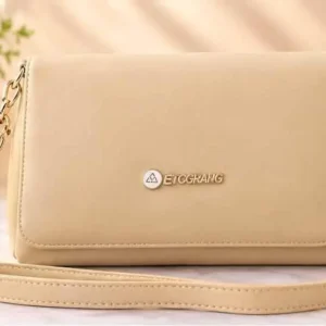Stylish light cream crossbody shoulder bag with golden chain accents and ETBGRANG logo at Sabuj Hub
