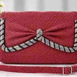 Stylish maroon crossbody shoulder bag with sparkly crystal bow embellishment at Sabuj Hub
