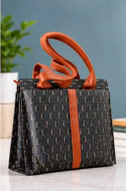 sabuj hub monogram handbag side view. sabuj hub monogram handbag side view.