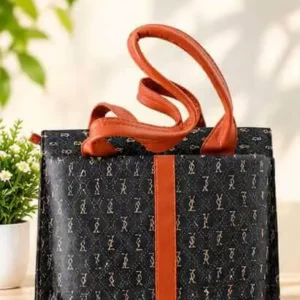 Sabuj Hub stylish monogram patterned handbag featuring brown handles and vertical accent stripe