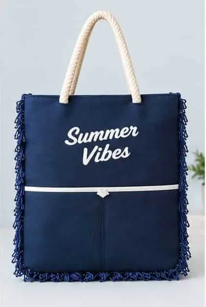Navy Blue Summer Vibes Tote Bag Front View Sabuj Hub Front view of Sabuj Hub navy blue canvas tote bag featuring Summer Vibes text print, rope handles, and side fringes detail