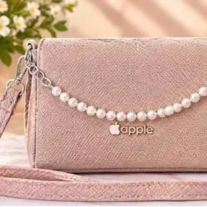 Home Stylish pink crossbody bag with pearl chain strap and apple logo detail at Sabuj Hub