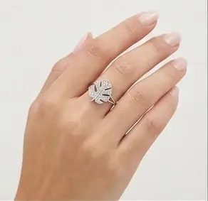 Home Silver Monstera Leaf Ring Encrusted with Sparkling Zircon Crystals Displayed on Female Hand