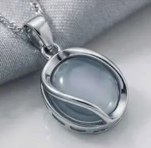 silver oval opal pendant close up detail